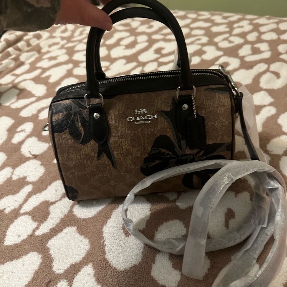 Coach Brown Signature Rowan Satchel with Black Trim. Bows regular size Rowan.